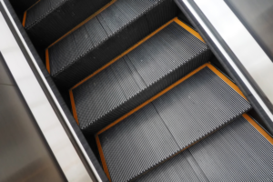 Step-type escalators